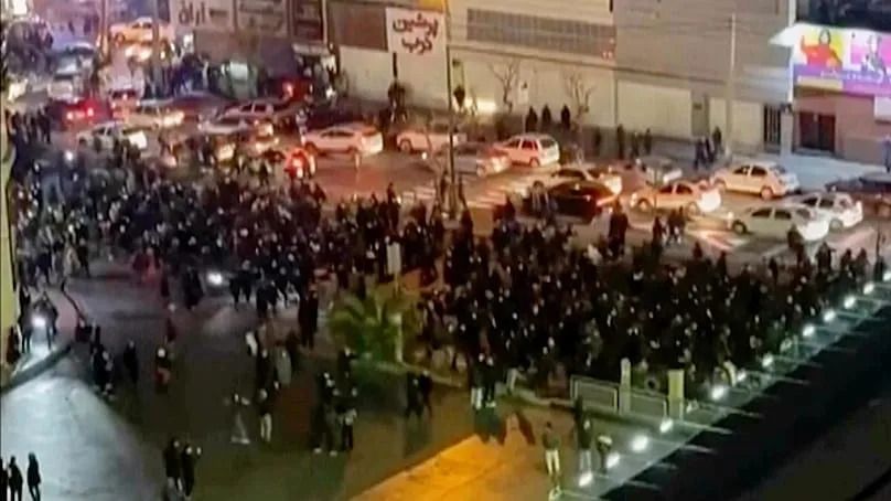 In this frame grab from video, protesters block an intersection during a protest in Tehran, 8 January, 2026