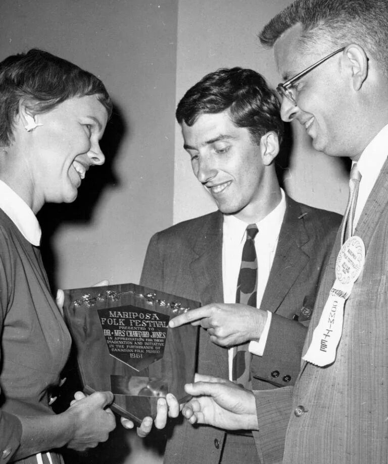 This undated photo from the early 1960s shows Mariposa Folk Festival founders Ruth Jones McVeigh, left, and Dr. Crawford Jones, receiving a commemorative plaque.
