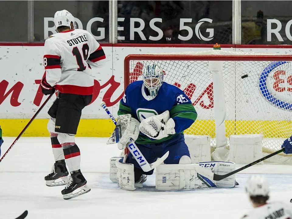 Senators forward Tim Stutzle scores on Canucks starting goalie Thatcher Demko at Rogers Arena on April 22, 2021.