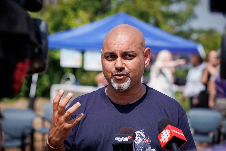 Feed Scarborough Food Bank founder Suman Roy gives an interview outside the charity's St. Clair Ave. warehouse on Aug. 3, 2023.
