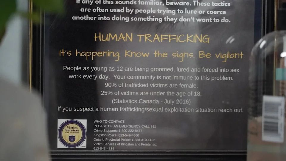 A pamphlet posted in the Victims Services office at Kingston Police headquarters warns about the sights someone is caught up in human trafficking.
