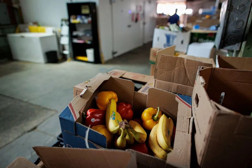 Volunteers and staff with the Feed Scarborough Food Bank unload donations at the charitys St. Clair Ave. warehouse on Aug. 3, 2023.